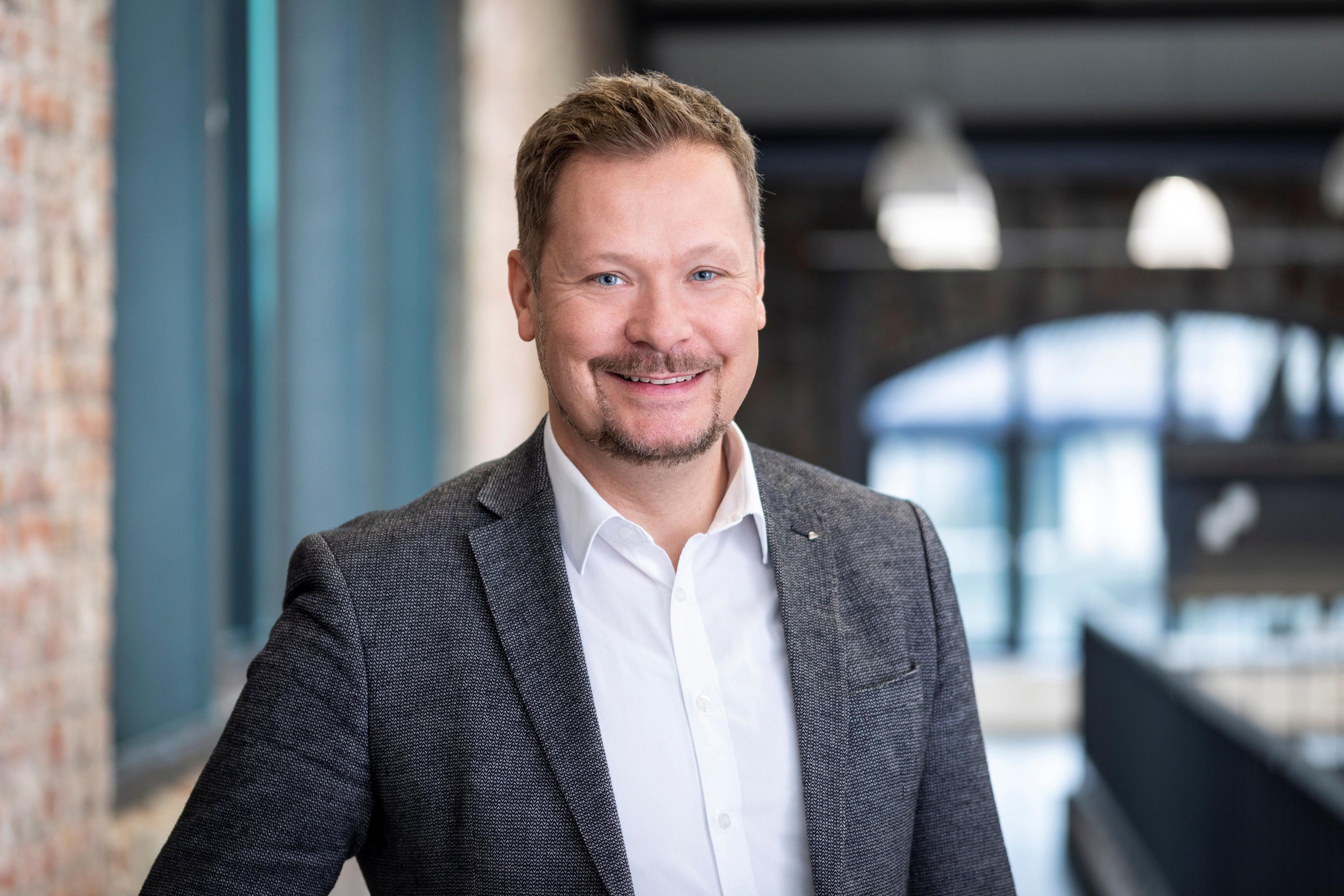 Mario Penzkofer lächelt freundlich in die Kamera.